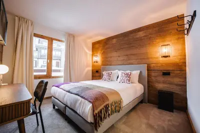 Un ou plusieurs lits dans un hébergement de l'établissement Hotel Emeraude