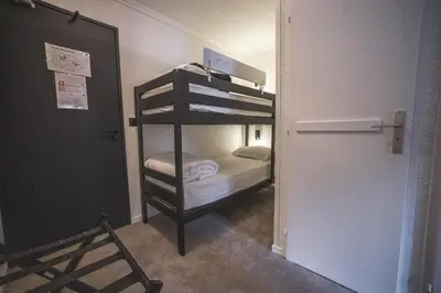Un ou plusieurs lits dans un hébergement de l'établissement Hotel Emeraude