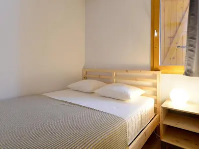 Un ou plusieurs lits dans un hébergement de l'établissement Appartement cosy proche pistes - Balcon et Wifi - FR-1-181-1017