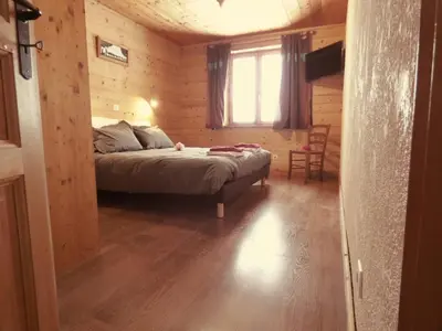 Un ou plusieurs lits dans un hébergement de l'établissement Chalet Le Bois Joli