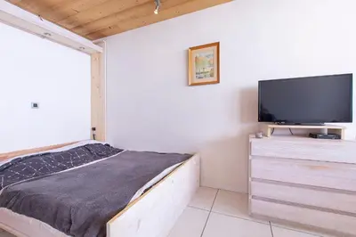 Télévision ou salle de divertissement dans l'établissement Tignes - Studio au pied des pistes