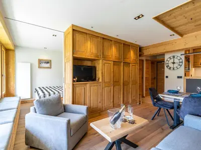 Télévision ou salle de divertissement dans l'établissement Apartment Les Cimes - Le Lac by Interhome