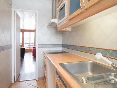 Cuisine ou kitchenette dans l'établissement 2 pièces sud/ouest, ski aux pieds, wifi gratuit - FR-1-449-26