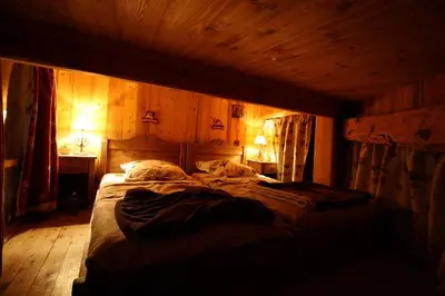 Un ou plusieurs lits dans un hébergement de l'établissement Appartement duplex de charme hyper centre à Val d'Isère