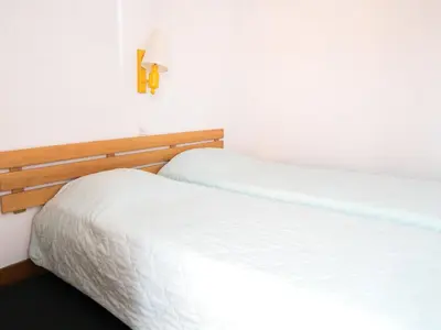 Un ou plusieurs lits dans un hébergement de l'établissement Appartement 2 pièces sud/ouest avec Wifi, proche pistes - FR-1-449-157