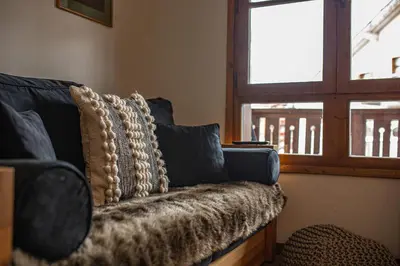 Coin salon dans l'établissement Arc 1950 Appartement skis aux pieds