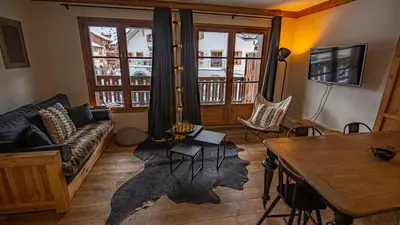 Coin salon dans l'établissement Arc 1950 Appartement skis aux pieds