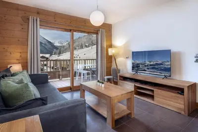 Télévision ou salle de divertissement dans l'établissement ALPA appartements - Champagny-en-Vanoise