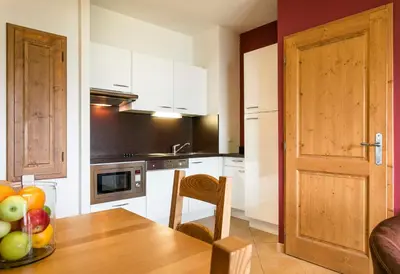 Cuisine ou kitchenette dans l'établissement Résidence Club MMV L'Étoile des Cimes