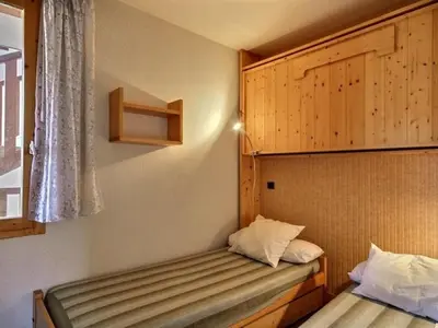 Un ou plusieurs lits dans un hébergement de l'établissement Appartement 2 pièces avec balcon au pied des pistes, 4 personnes - FR-1-455-14
