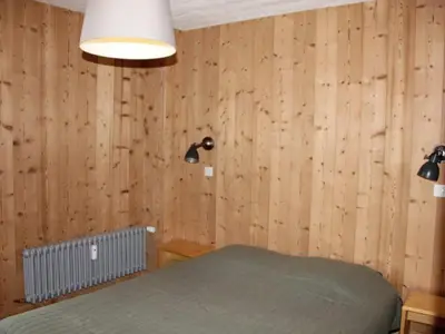 Un ou plusieurs lits dans un hébergement de l'établissement Confort 2 pièces pied des pistes avec balcon et parking à Tignes - FR-1-449-57