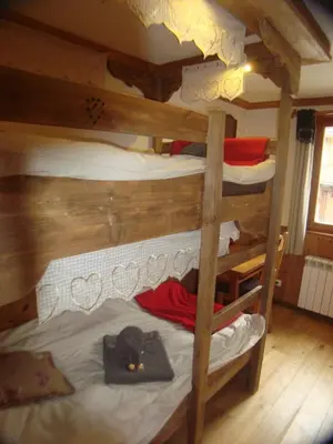 Un ou plusieurs lits dans un hébergement de l'établissement Chalet l'Avalin