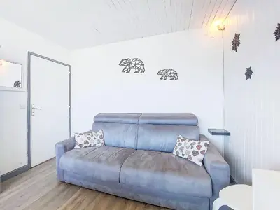 Coin salon dans l'établissement Apartment Horizon 2000 - Le Lac by Interhome