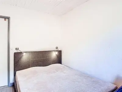 Un ou plusieurs lits dans un hébergement de l'établissement Apartment Horizon 2000 - Le Lac by Interhome