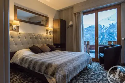 Un ou plusieurs lits dans un hébergement de l'établissement ALPINA LODGE VANOISE ex hotel du soleil