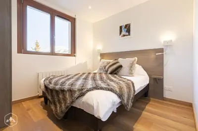 Un ou plusieurs lits dans un hébergement de l'établissement ALPINA LODGE VANOISE ex hotel du soleil