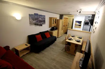 Coin salon dans l'établissement Appartement Le Thuria