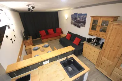 Coin salon dans l'établissement Appartement Le Thuria
