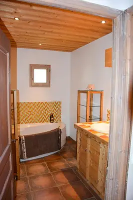 Un ou plusieurs lits dans un hébergement de l'établissement Chalet des Trappeurs Coeur Vanoise 15 persons