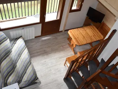 Coin salon dans l'établissement Charmant appartement 2 pièces avec mezzanine, Pralognan-la-Vanoise - FR-1-464-5
