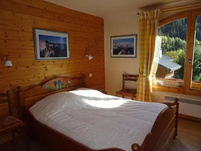 Un ou plusieurs lits dans un hébergement de l'établissement Triplex confortable 12 pers, terrasse, garage, Champagny-en-Vanoise - FR-1-464-19