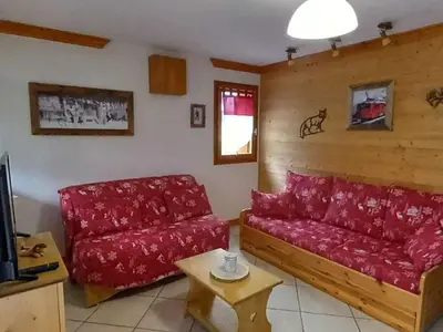 Coin salon dans l'établissement Appartement cosy et lumineux avec jardin, pour 6 personnes - FR-1-464-26