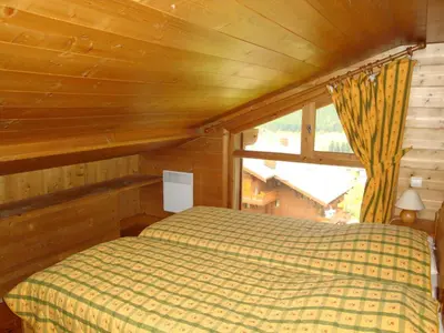 Un ou plusieurs lits dans un hébergement de l'établissement Grand duplex 6 personnes avec balcon dans les Alpes - FR-1-464-33
