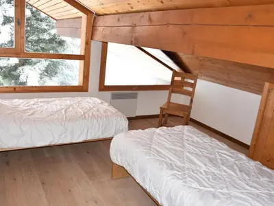 Un ou plusieurs lits dans un hébergement de l'établissement Duplex spacieux avec garage proche centre Champagny - FR-1-464-41