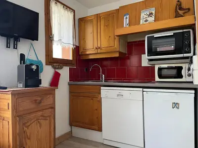 Cuisine ou kitchenette dans l'établissement Appartement ensoleillé pour 7 pers, près du centre - FR-1-464-49