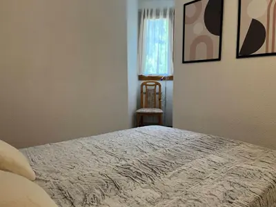 Un ou plusieurs lits dans un hébergement de l'établissement Appartement ensoleillé pour 7 pers, près du centre - FR-1-464-49