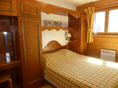 Un ou plusieurs lits dans un hébergement de l'établissement Charmant appartement familial avec terrasse, proche des pistes - FR-1-464-57