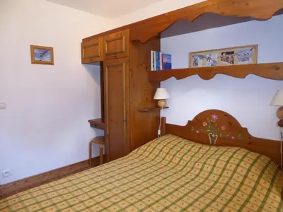 Un ou plusieurs lits dans un hébergement de l'établissement Charmant appartement familial avec terrasse, proche des pistes - FR-1-464-57