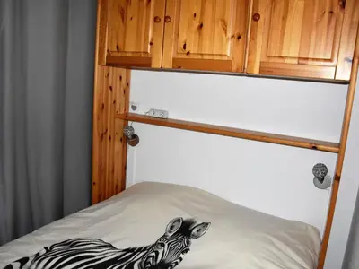 Un ou plusieurs lits dans un hébergement de l'établissement Charmant 2 pièces avec terrasse et animaux admis, centre Pralognan - FR-1-464-92