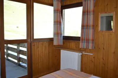 Un ou plusieurs lits dans un hébergement de l'établissement Chalet Reymond Pre du lac