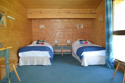 Un ou plusieurs lits dans un hébergement de l'établissement Chalet Reymond Pre du lac