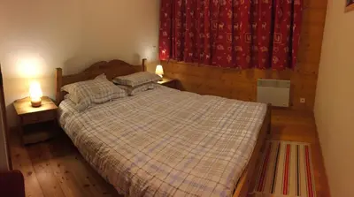 Un ou plusieurs lits dans un hébergement de l'établissement appartement fogliettaz
