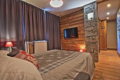 Un ou plusieurs lits dans un hébergement de l'établissement Appartements résidence Roches Rouges