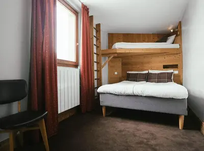 Un ou plusieurs lits dans un hébergement de l'établissement Langley Hôtel Victors