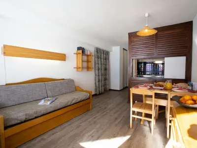 Coin salon dans l'établissement Apartment Le Borsat - Val Claret-10 by Interhome