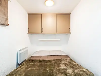 Un ou plusieurs lits dans un hébergement de l'établissement Apartment Les Olympiques - Tignes 1800-4 by Interhome