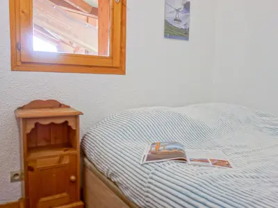 Un ou plusieurs lits dans un hébergement de l'établissement Apartment La Divaria - Le Lac-3 by Interhome