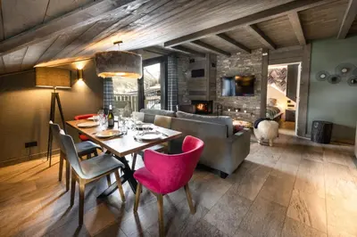 Coin salon dans l'établissement Chalets Izia - Village Montana