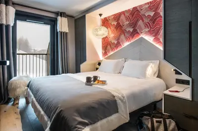 Un ou plusieurs lits dans un hébergement de l'établissement Chalets Izia - Village Montana
