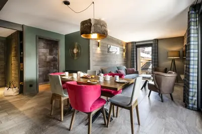 Coin salon dans l'établissement Chalets Izia - Village Montana