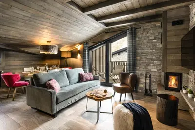 Coin salon dans l'établissement Chalets Izia - Village Montana