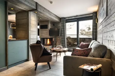 Coin salon dans l'établissement Chalets Izia - Village Montana