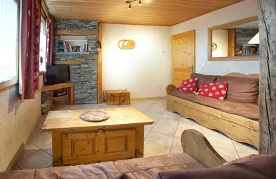 Coin salon dans l'établissement Chalet la Lauzette