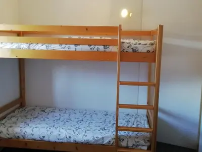 Un ou plusieurs lits superposés dans un hébergement de l'établissement Duplex 3 pièces pour 6 pers., vue vallée, proche pistes, animaux admis à Arc 1800 - FR-1-411-228