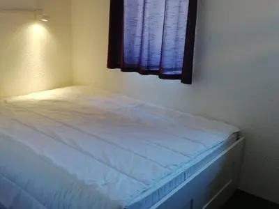 Un ou plusieurs lits dans un hébergement de l'établissement Duplex 3 pièces pour 6 pers., vue vallée, proche pistes, animaux admis à Arc 1800 - FR-1-411-228