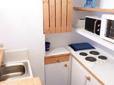 Cuisine ou kitchenette dans l'établissement Duplex 3 pièces 6 pers proche pistes à Arc 1800 - FR-1-411-40
